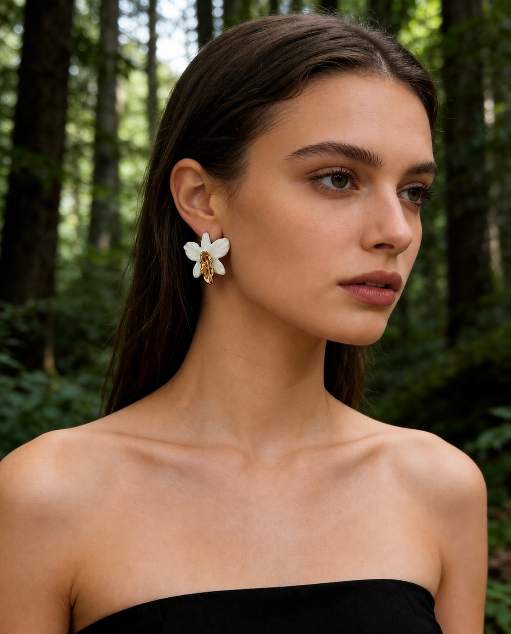 Close editorial crop of ZELIN ART earrings worn by model